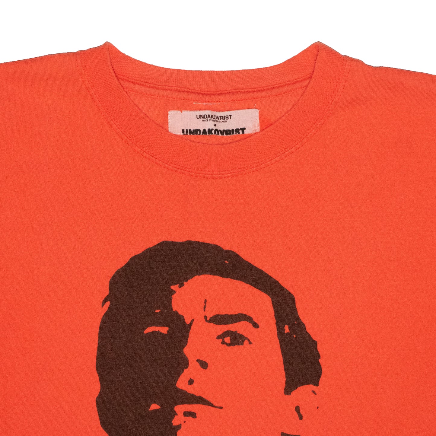 UNDAKOVRIST by Undercover Madman Tee